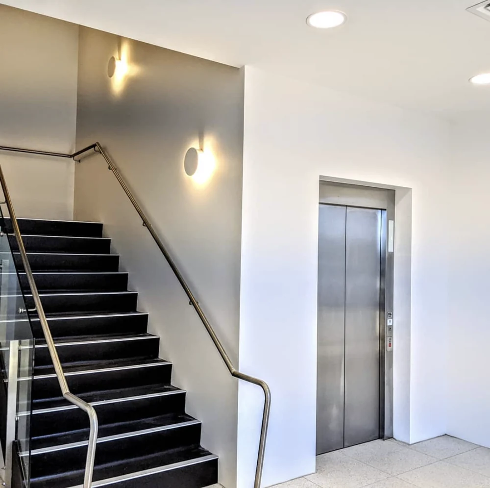 Painted walls around the staircase and lift lobby at the Ocean Grove commercial project